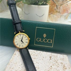 Gucci Black and Gold Roman Numeral Watch